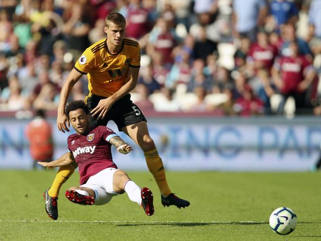 Wolverhampton Wanderers' Ryan Bennett, top, pulls back on West Ham United's Felipe Anderson. Picture: PA via AP