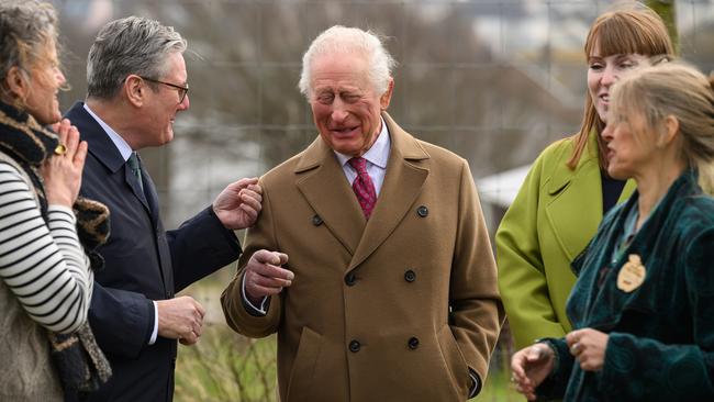 King Charles has a laugh with British Prime Minister Keir Starmer, left, during a tour of a housing development in Cornwall, southwest England. Picture: Getty Images