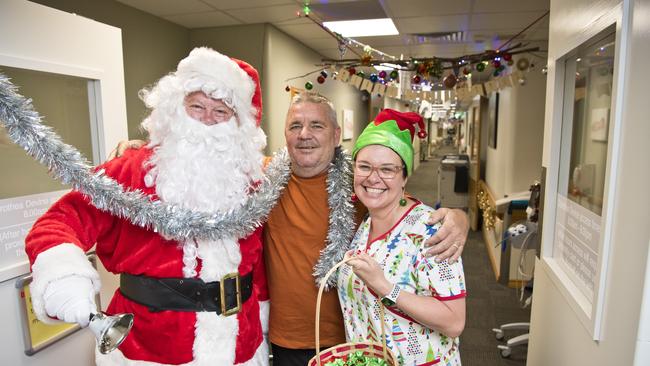 Leyburn local Alex Sinclair, visiting a friend who has just had a baby, meets with Santa and his elf Paula McDonald at St Vincent's Private Hospital, Friday, December 20, 2019. Picture: Kevin Farmer