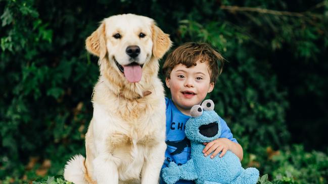 Koa from Port Lincoln with the family dog, Louie. Koa won the Advertiser's cutest kindy kid in the state competition. Picture: Robert Lang