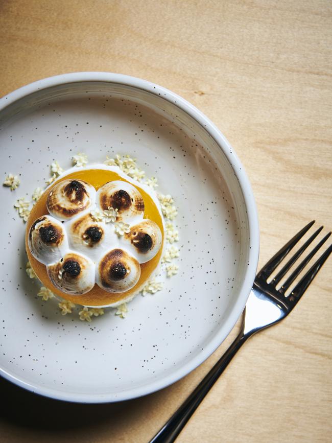 Mango and coconut bombe Alaska with toasted coconut crumb. Photo: Eugene Hyland