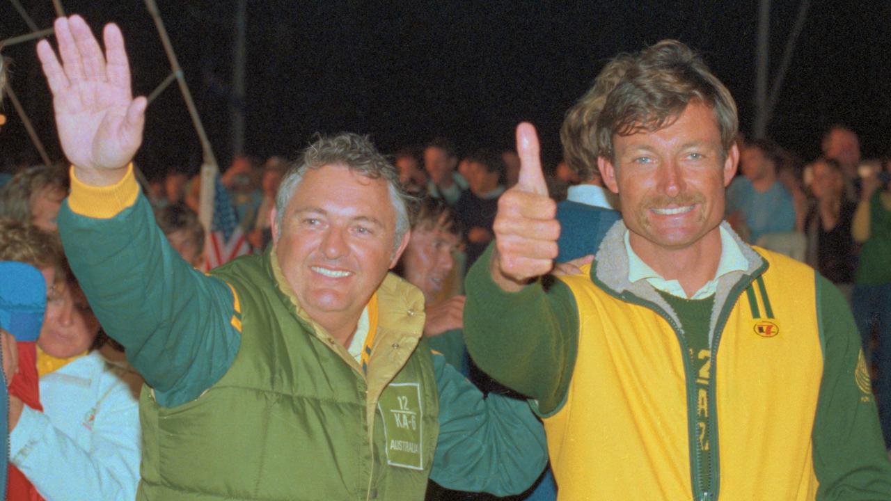 Alan Bond and John Bertrand of Australia wave and give the “thumbs-up”after defeating the United States in the America's Cup in 1983.