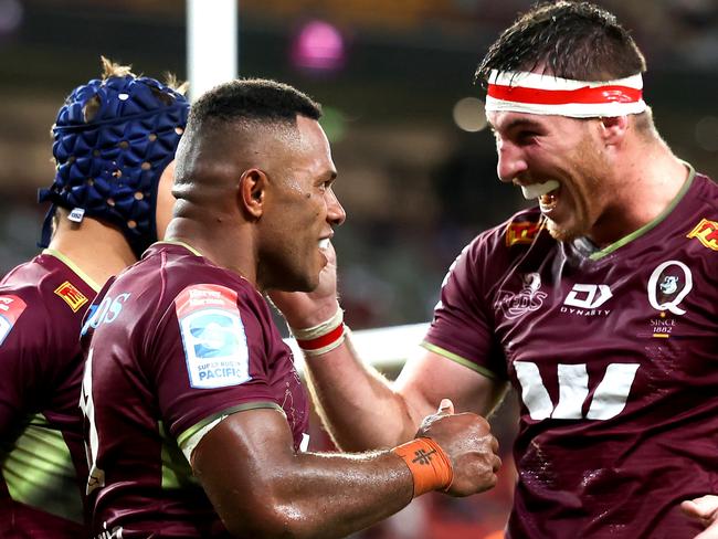 BRISBANE, AUSTRALIA - APRIL 02: Filipo Daugunu of the Reds celebrates with team mates after scoring a try during the round seven Super Rugby Pacific match between the Queensland Reds and the ACT Brumbies at Suncorp Stadium on April 02, 2022 in Brisbane, Australia. (Photo by Albert Perez/Getty Images)