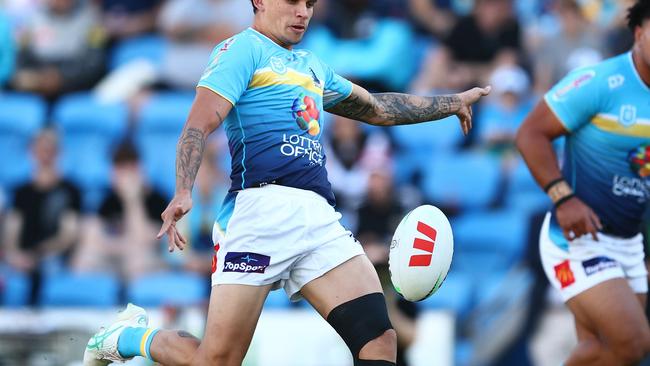 GOLD COAST, AUSTRALIA - JUNE 08: Jayden Campbell of the Titans kicks during the round 14 NRL match between Gold Coast Titans and South Sydney Rabbitohs at Cbus Super Stadium, on June 08, 2024, in Gold Coast, Australia. (Photo by Chris Hyde/Getty Images)