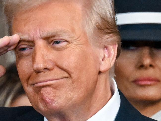 TOPSHOT - President Donald Trump and Melania Trump during the inauguration of Donald Trump as the 47th president of the United States takes place inside the Capitol Rotunda of the U.S. Capitol building in Washington, D.C., Monday, January 20, 2025. It is the 60th U.S. presidential inauguration and the second non-consecutive inauguration of Trump as U.S. president. (Photo by Kenny Holston/The New York Times / AFP)