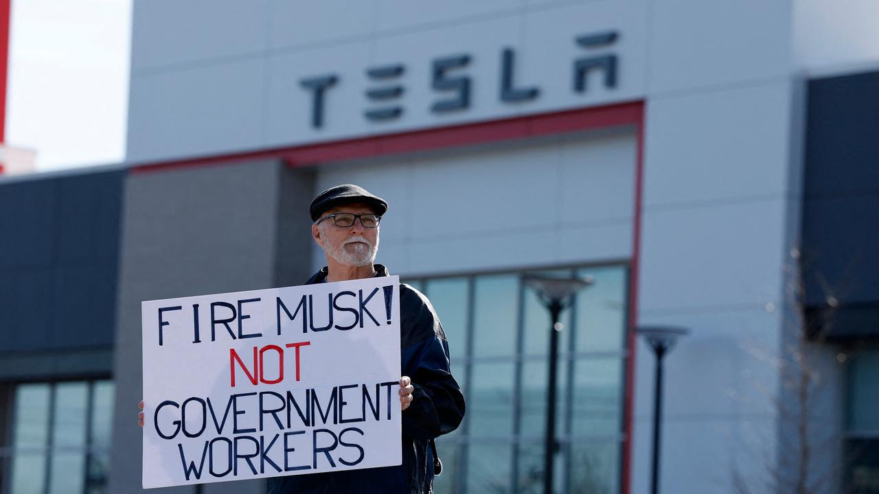 <!DOCTYPE html PUBLIC "-//W3C//DTD HTML 4.0 Transitional//EN" "http://www.w3.org/TR/REC-html40/loose.dtd"><html><body><p>A protester holds a sign that reads &acirc;&#128;&#152;Fire Musk! Not government workers&acirc;&#128;&#153; outside a Tesla dealership in Michigan. Picture: Jeff Kowalsky/AFP</p></body></html>