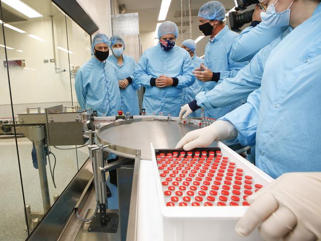 Prime Minister Scott Morrison visit to CSL serum lab to inspect COVID-19 Immunoglobulin being produced in Parkville Melbourne. The PM inspects freshly produced vaccine vials.  Picture: David Caird POOL IMAGES