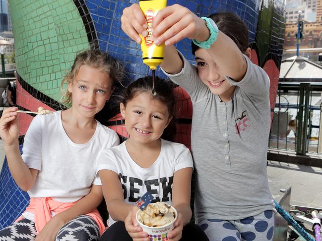 Dior, Kiri and Alexis try to keep an open mind about Vegemite ice-cream. Picture- Nicole Cleary