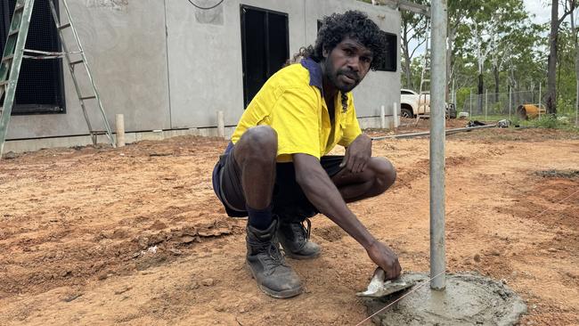 Wesley Miler helping build new homes in NT Indigenous community Wadeye. Picture: Supplied.