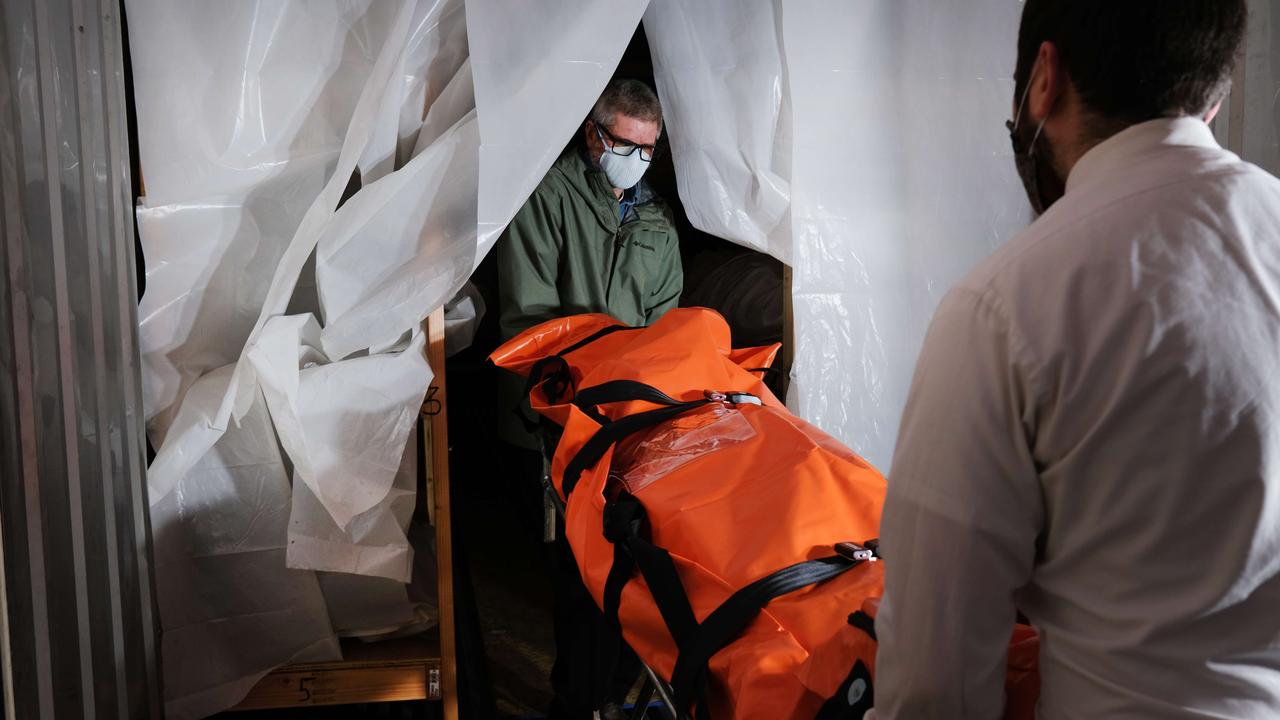 The body of a coronavirus victim is transported to a refrigerated container at a funeral home in Queens on April 29, 2020 in New York City. Picture: Spencer Platt/Getty Images/AFP.