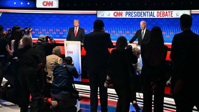 Donald Trump and President Biden during a break at the presidential debate. Picture: AFP/Getty Images