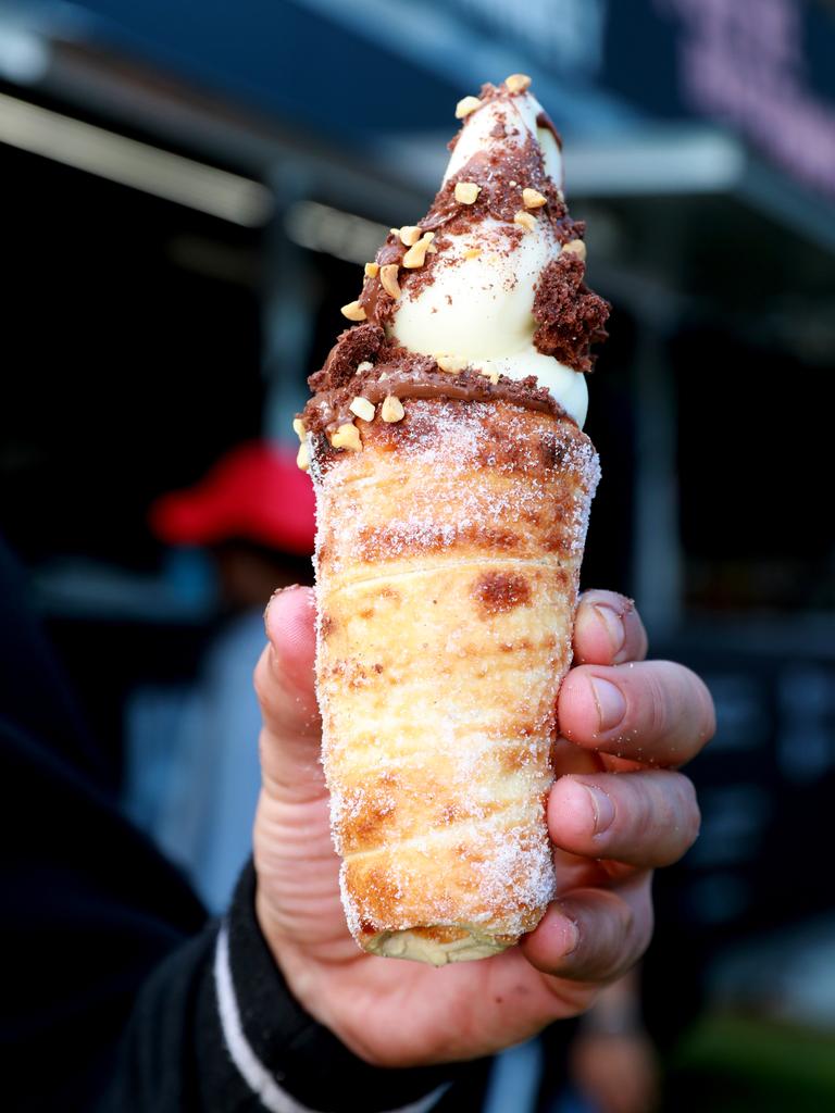 Pedj Bojic owner of Pimp my chimney holds one of his famous deserts Naughty nuts at the Cherry Blossom Festival in Auburn. (AAP IMAGE / Angelo Velardo)