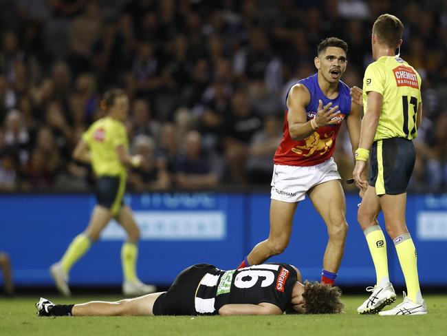 Charlie Cameron argues with the umpire as Chris Mayne lies on the turf. Picture: Darrian Traynor/Getty Images