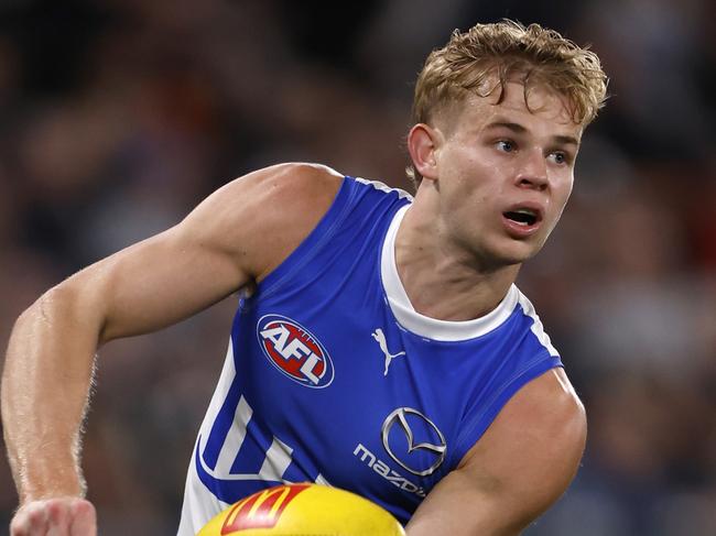 MELBOURNE, AUSTRALIA - JULY 21:  Jackson Archer of the Kangaroos handballs during the round 19 AFL match between Carlton Blues and North Melbourne Kangaroos at Marvel Stadium, on July 21, 2024, in Melbourne, Australia. (Photo by Darrian Traynor/Getty Images)