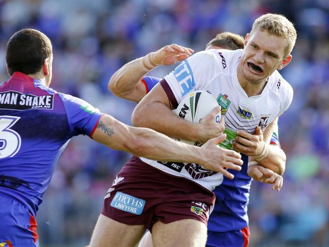 Tom Trbojevic of the Sea Eagles busts tackles from Jarrod Mullen and Tyler Randell of the Knights to score during the Round 8 NRL match between the Newcastle Knights and the Manly Sea Eagles at Hunter Stadium, Newcastle, Monday, 25th April , 2016. (AAP Image/Darren Pateman) NO ARCHIVING, EDITORIAL USE ONLY