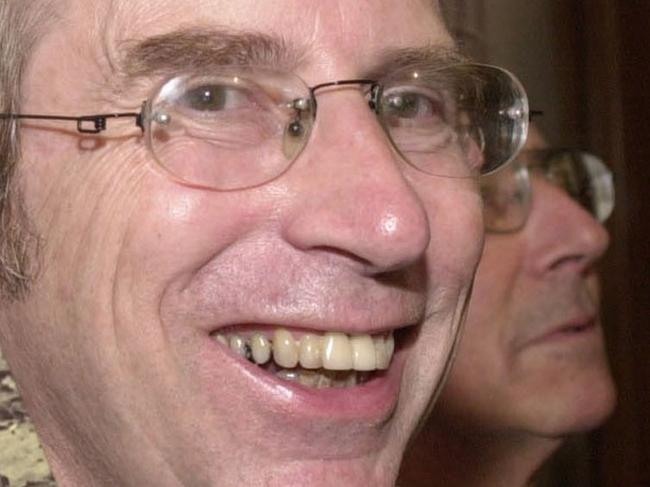 17/10/2001 Australian author Peter Carey, 58, who won the Booker Prize for his novel 'True History Of The Kelly Gang', holds up a copy of the book in London's Guildhall.