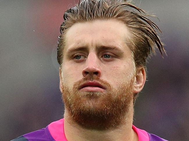 MELBOURNE, AUSTRALIA - AUGUST 12:  Cameron Munster of the Storm looks on during the round 22 NRL match between the Melbourne Storm and the Cronulla Sharks at AAMI Park on August 12, 2018 in Melbourne, Australia.  (Photo by Graham Denholm/Getty Images)