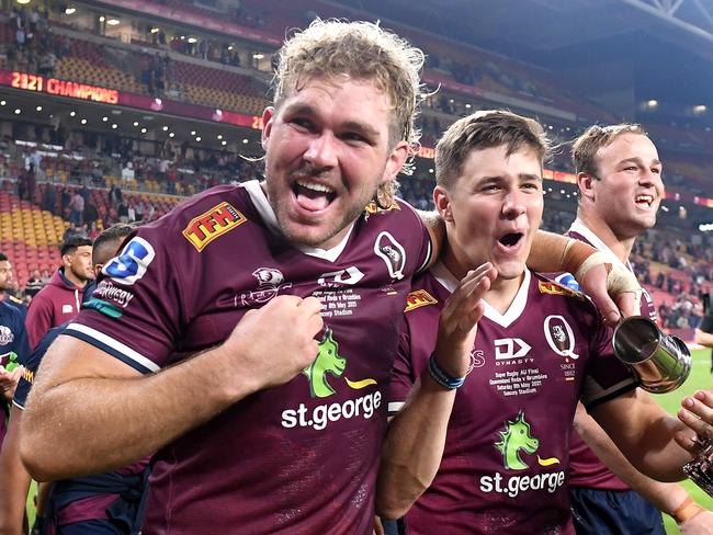 BRISBANE, AUSTRALIA - MAY 08: Angus Scott-Young and Joshua Flook of the Reds celebrate victory after the Super RugbyAU Final match between the Queensland Reds and the ACT Brumbies at Suncorp Stadium, on May 08, 2021, in Brisbane, Australia. (Photo by Bradley Kanaris/Getty Images)