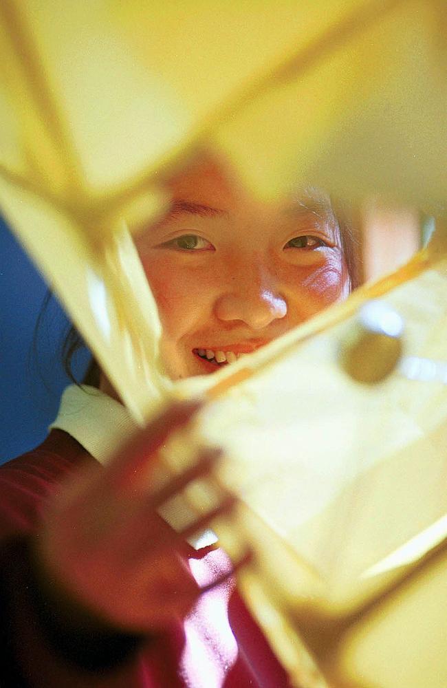 Eangnie Song a student from Cabramatta H.S with a lantern for the moon festival in 2000. Picture: Armen Deushian