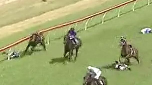 Three jockeys Emily Atkinson (So Super, white and blue silks), Luke Rolls (Cutting Loose, black and blue silks) and Tennille Gray (Baltic Cavalier, white silks) fell off their horses during race one at Clarence River Jockey Club in Grafton on Monday, 29th March, 2021.