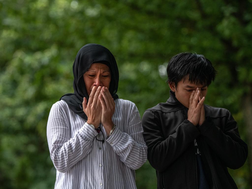  People pray near Al Noor mosque. Picture: Getty Images