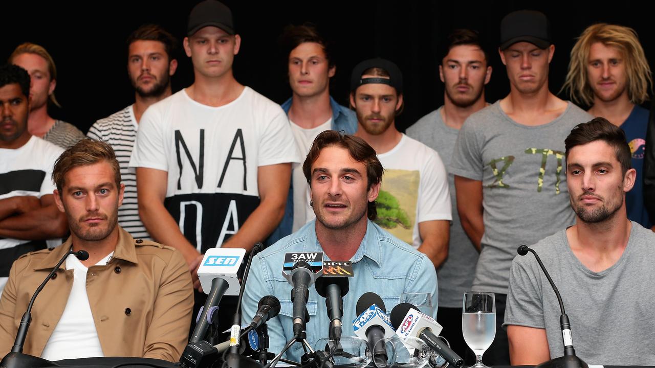 Jobe Watson and his Essendon teammates front the media after being banned in 2015. Picture: Getty Images