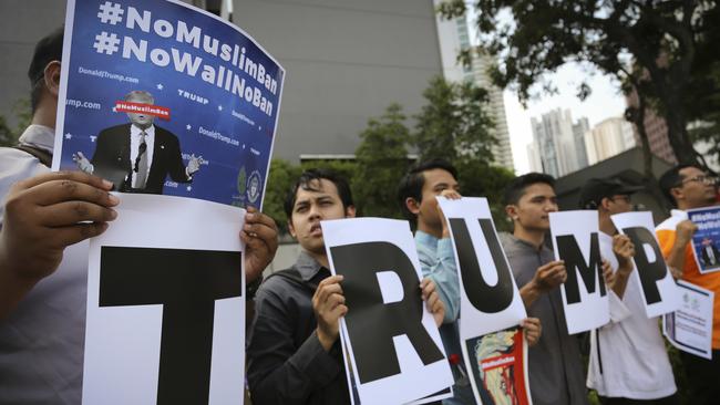 Muslim protesters demonstrate against President Trump's immigration ban outside the U.S. Embassy in Kuala Lumpur, Malaysia. Picture: AP/Vincent Thian.