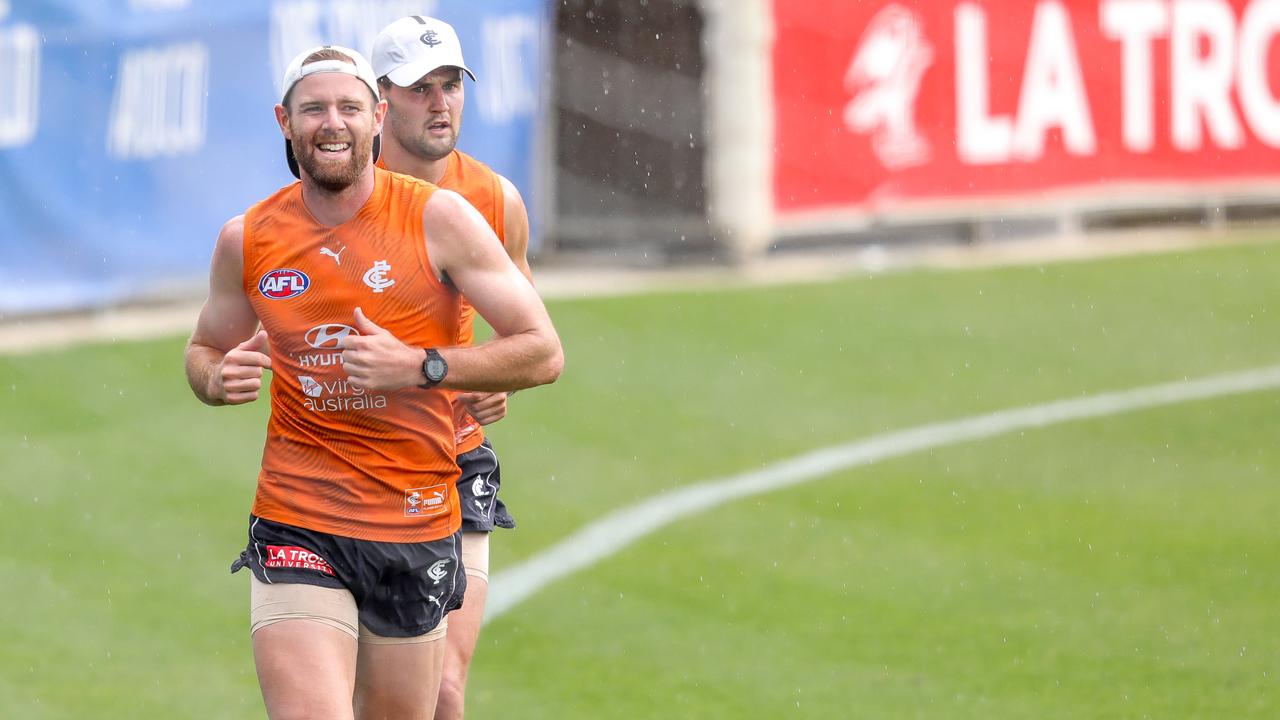 Sam Docherty runs laps at Carlton training with Nic Newman. Pictures: Tim Carrafa