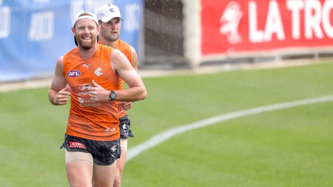 Sam Docherty runs laps at Carlton training with Nic Newman. Pictures: Tim Carrafa