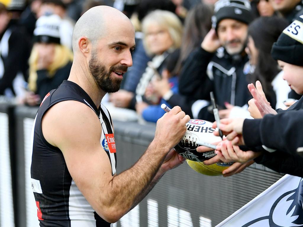 Pies teammates hope Steele Sidebottom will play on. Picture: Josh Chadwick/Getty Images