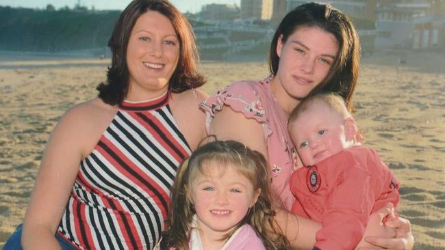 Jordan Thompson is held in this family picture by his mother.