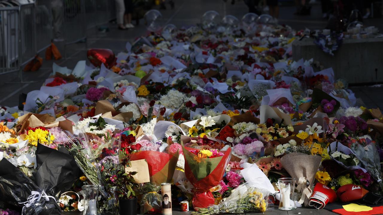 Floral tributes on the mall at Bondi Junction after six people were fatally stabbed at the adjacent Westfield on Saturday. Picture: Richard Dobson.