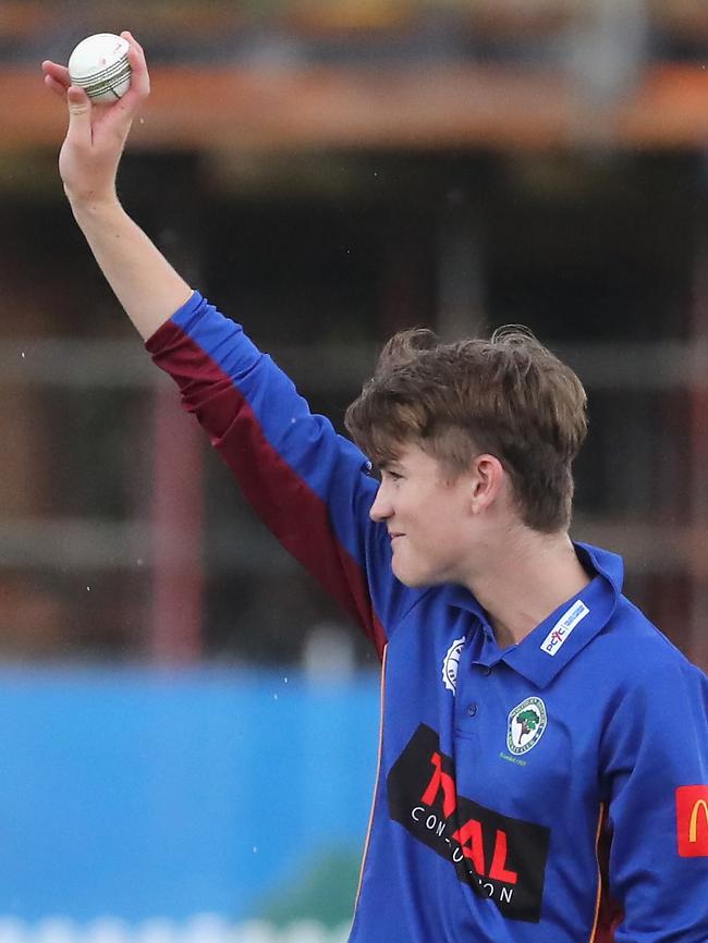 Mackay raising the ball after his six wicket haul. Picture: Jeremy Ng
