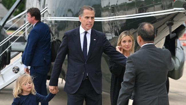 Hunter Biden (C) walks with his son Beau and his wife Melissa Cohen Biden on the tarmac of Delaware Air National Guard Base in New Castle, Delaware. Picture: AFP