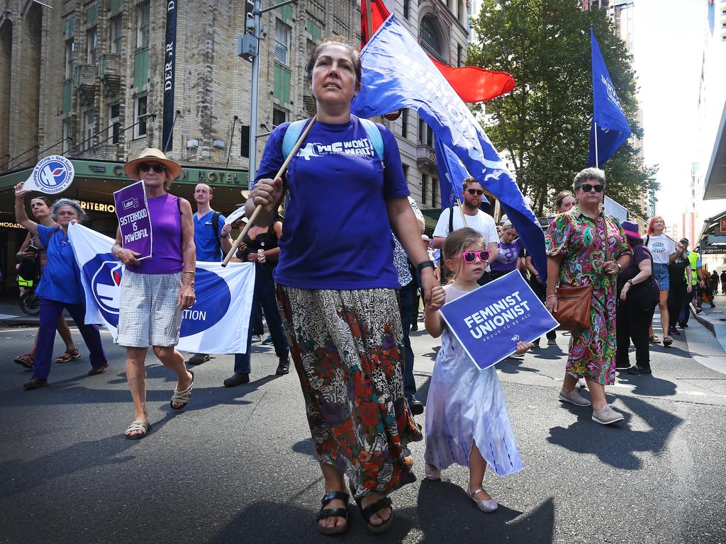 Activists march through the CBD in Sydney for International Women's Day. Picture: Lisa Maree Williams/Getty Images