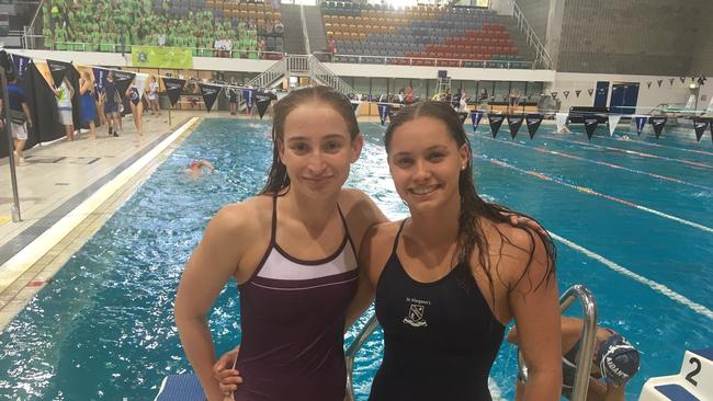 Mollie O'Callaghan of St Peters Lutheran College with Tahlia Thornton (St Margaret’s) at the QGSSSA swim meet. The pair were team mates at the world junior swimming championships.