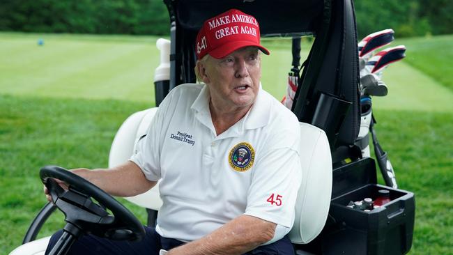 Donald Trump rolls along the greens at his golf club in Bedminster, New Jersey, on Thursday. Picture: AFP