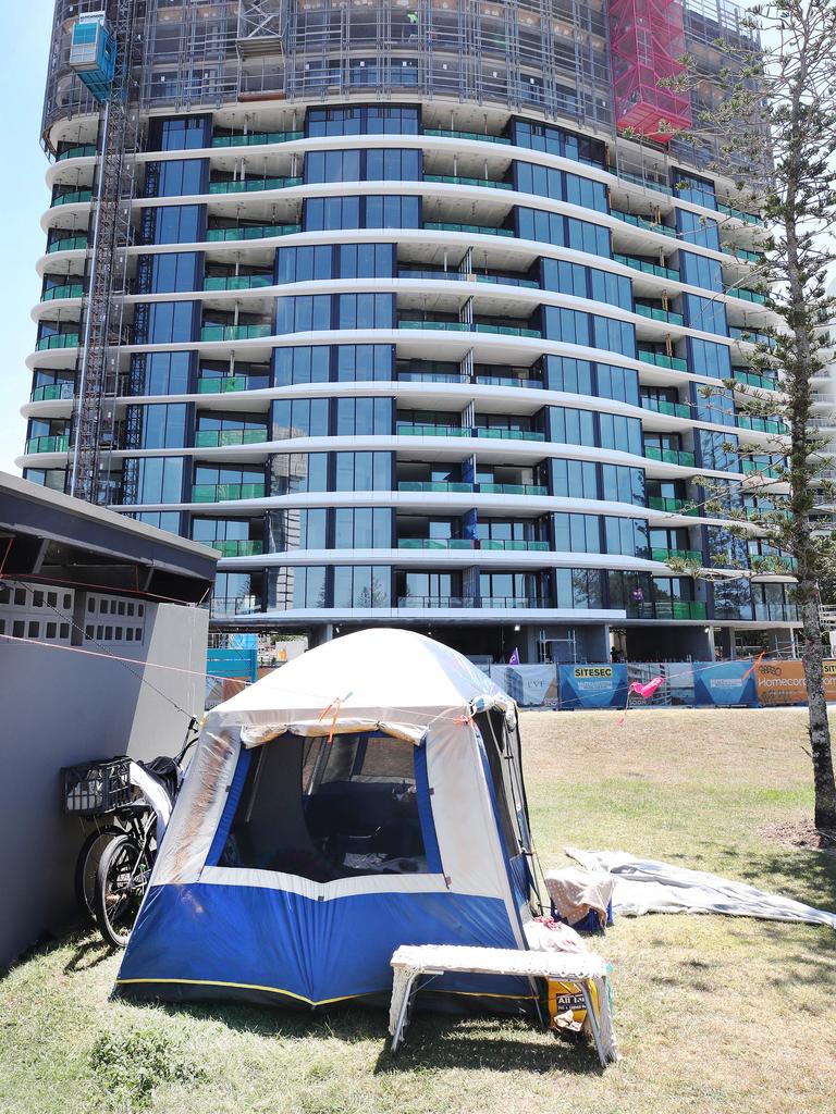 A tent belonging to homeless person , dwarfed by the new high rise being built behind it at Labrador, highlights the gap between the haves and the have nots on the Gold Coast. Picture Glenn Hampson