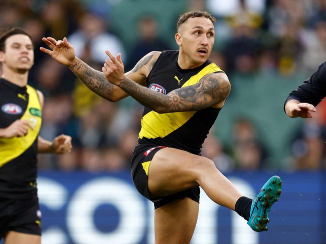 MELBOURNE, AUSTRALIA - JUNE 30: Shai Bolton of the Tigers kicks the ball during the 2024 AFL Round 16 match between the Richmond Tigers and the Carlton Blues at The Melbourne Cricket Ground on June 30, 2024 in Melbourne, Australia. (Photo by Michael Willson/AFL Photos via Getty Images)