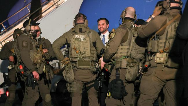 US Vice-President JD Vance speaks to German law enforcement personnel at Munich airport before boarding Air Force Two to return to Washington. Picture: AFP