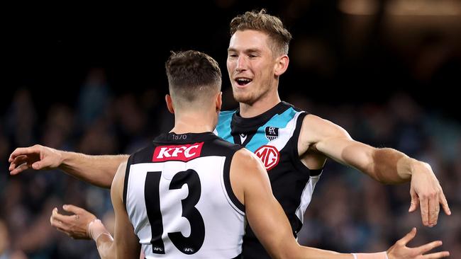 Orazio Fantasia and Kane Farrell celebrate a goal. Picture: James Elsby/AFL Photos/Getty Images