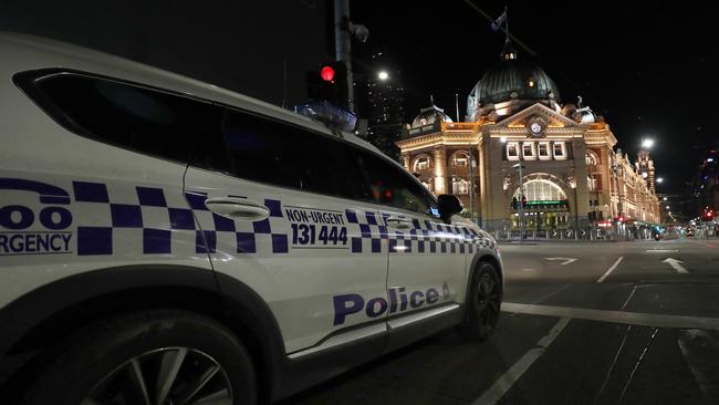 Victoria Police enforce an 8pm to 5am curfew in Melbourne’s CBD this week. Picture: Getty