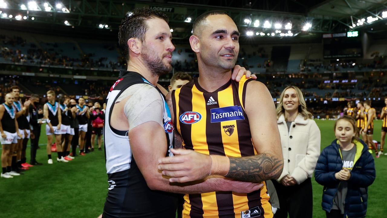 Hawks champ Shaun Burgoyne, with Port Adelaide’s Travis Boak, after his 400th game. Picture: Michael Willson/AFL Photos