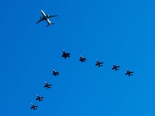 A Royal Australian Air Force E-7A Wedgetail, Airborne Early Warning and Control aircraft, a US Air Force F-22 Raptor, two RAAF F-35B Lightning II aircraft, two RAAF F/A-18F Super Hornets, US Navy F/A-18F Super Hornet, US Navy F/A-18E Super Hornet, RAAF EA-18G Growler and a U.S. Navy EA-18G Growler fly in formation over the USS Ronald Reagan in the Indian Ocean off the coast of Australia in support of Talisman Sabre 2023. Picture: MC2 Caroline H. Lui