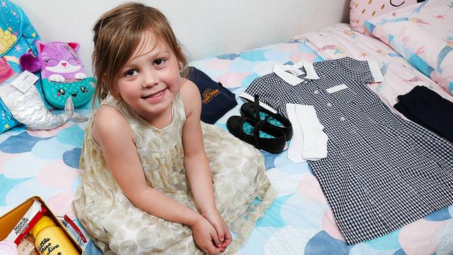 Lonnie lays out her uniform before starting school. Picture: Ian Currie