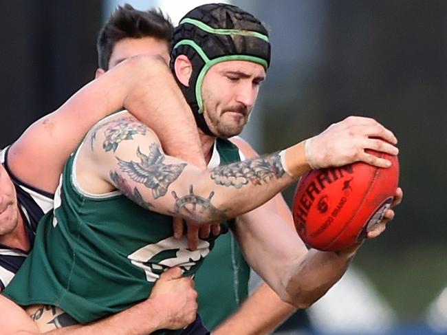 NFL Football: Bundoora v Greensborough, Christopher Clark with the ball. Picture: Steve Tanner