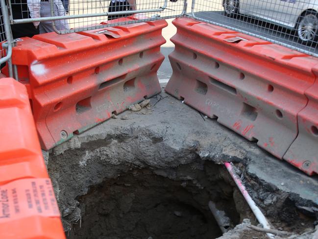 The large hole at Elizabeth and Chalmers Streets where the bones were found. Picture John Grainger