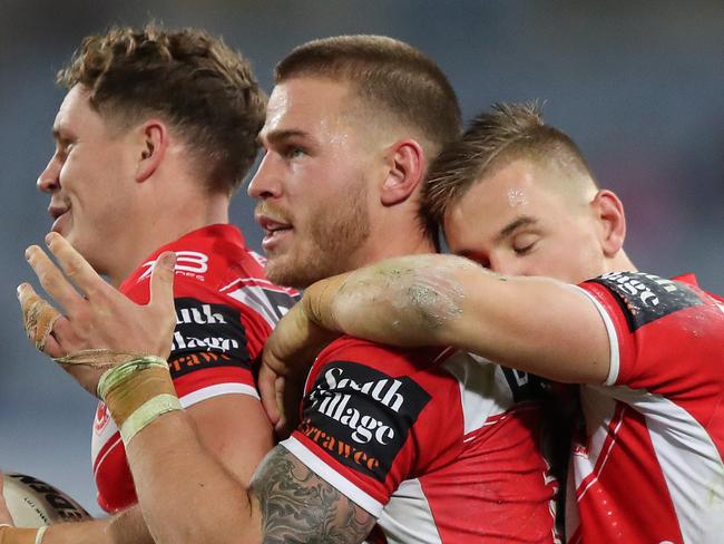 St George's Kurt Mann, Euan Aitken and Matt Dufty celebrate a close victory after the Bulldogs v St George NRL match at ANZ Stadium, Homebush. Picture: Brett Costello