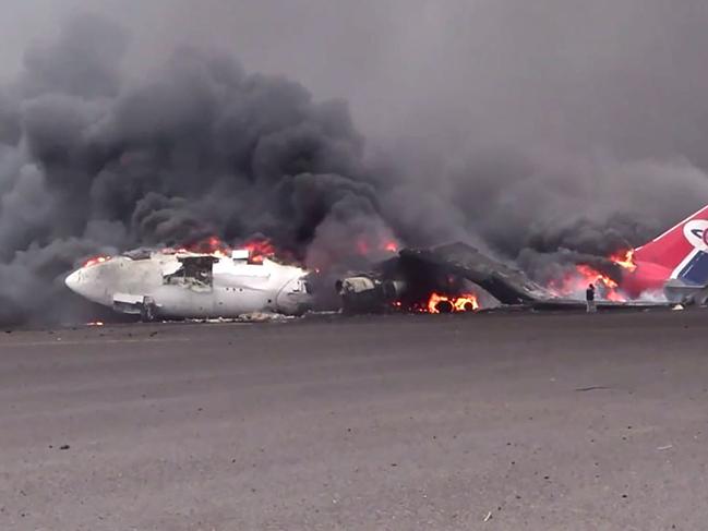 A burning aeroplane at Sanaa international airport after Israel's military warplanes struck Yemen's rebel-held capital Sanaa. Picture: AFP