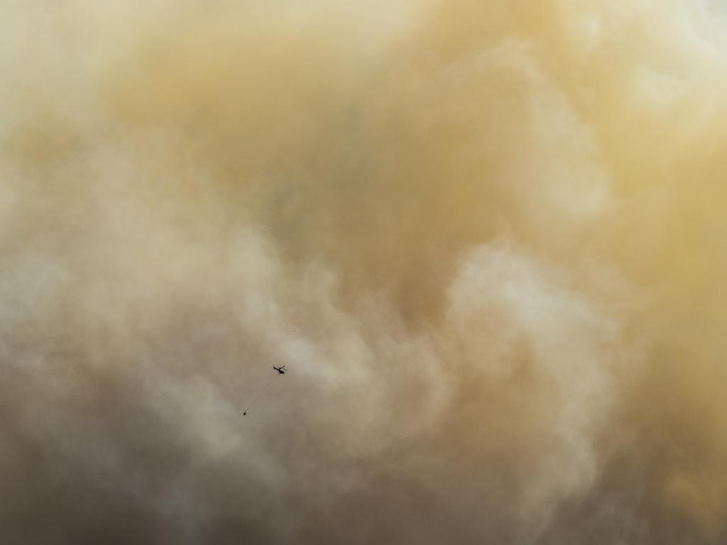 January 2019 Tasmanian Bushfires. Helicopter water-bombing over the Glen Huon area. Reader’s picture: NICK MONK